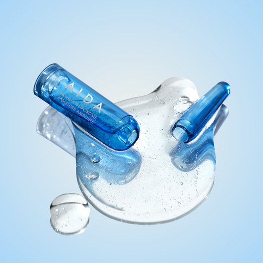 AIDA Hyal Multi-Liposome Moisture Ampoule with transparent liquid on glossy surface