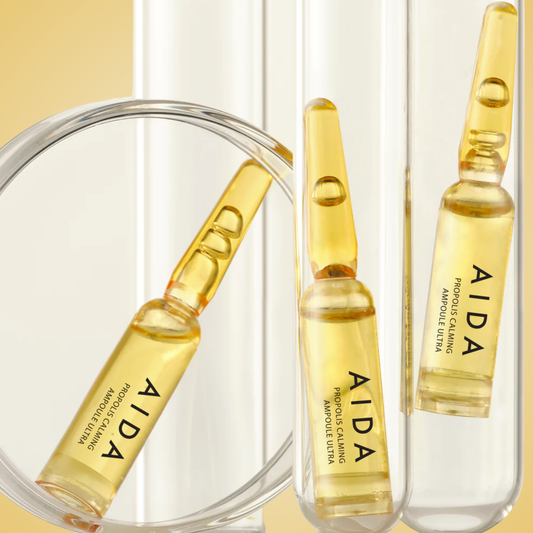 AIDA Propolis Calming Ampoule Ultra set displayed with clear golden serum and packaging box