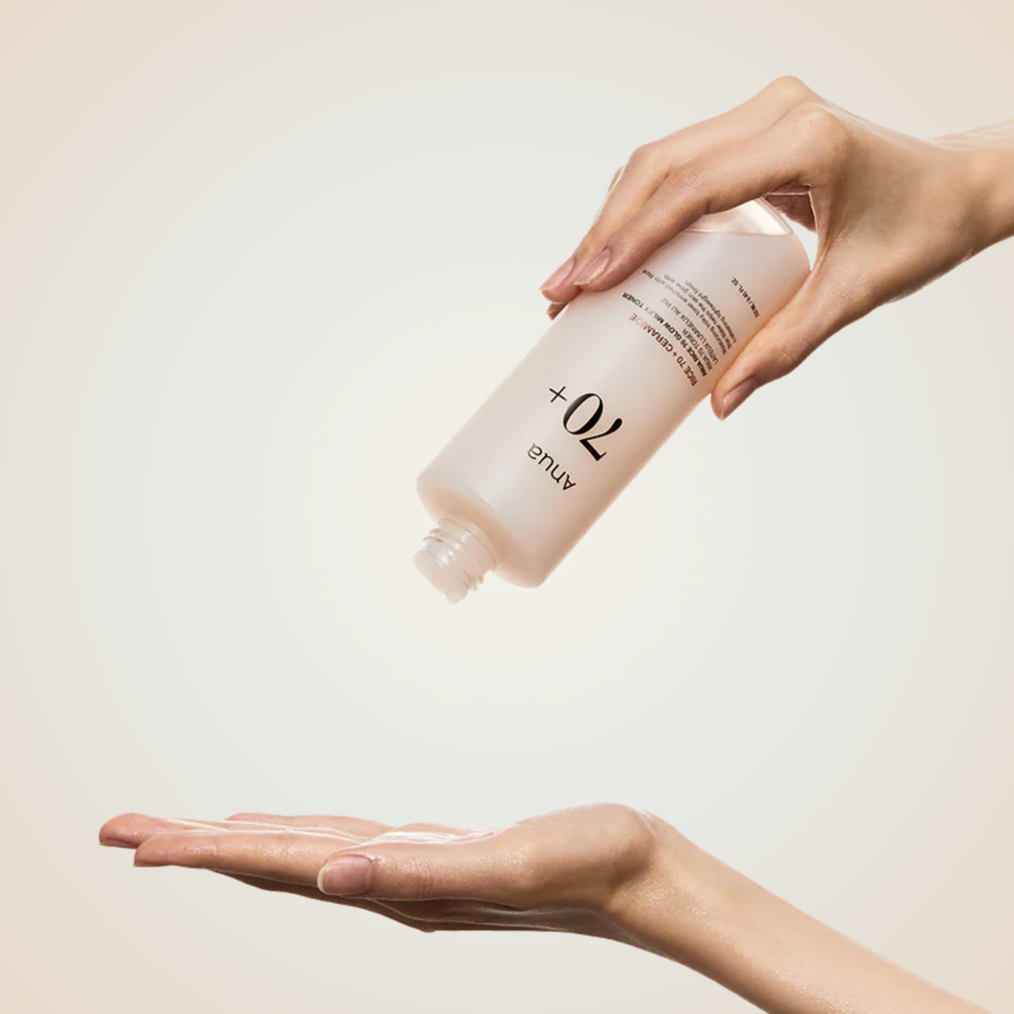 Applying Anua Rice 70 Glow Milky Toner on hands – soothing, nourishing toner that reveals a natural glow