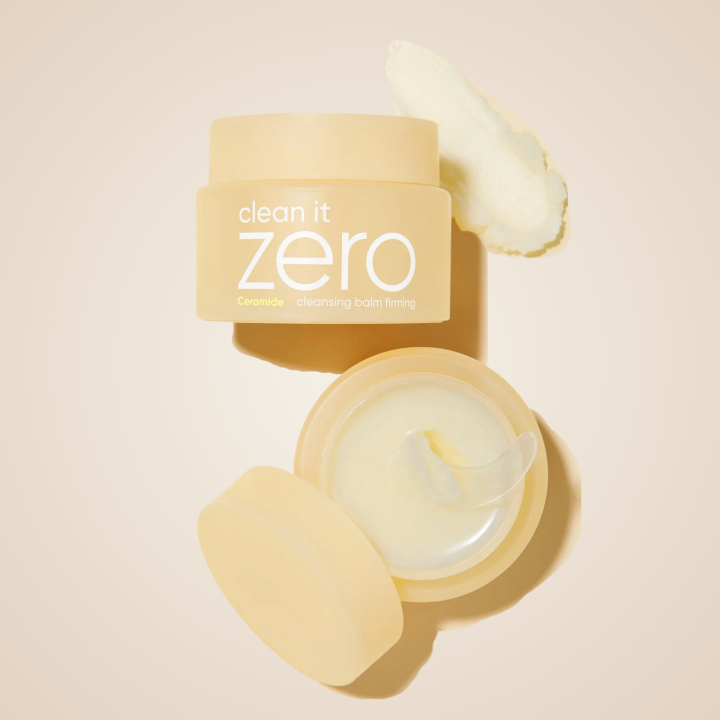 Flatlay of Banila Co Clean It Zero Ceramide Cleansing Balm with flowers – nourishing, gentle makeup remover