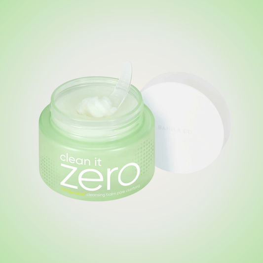 Open jar of Banila Co Clean It Zero Pore Clarifying Cleansing Balm with creamy green texture and spatula