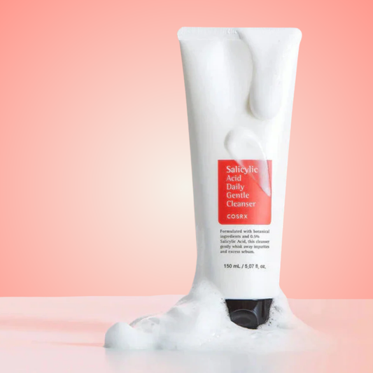 COSRX Salicylic Acid Daily Gentle Cleanser with rich foam texture on pink background