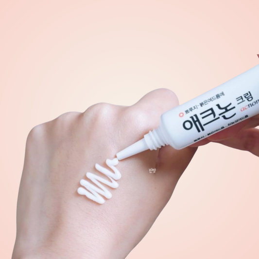 Applying Dong-A Pharm Acnon Cream on hand – reduces inflammation and supports clear skin