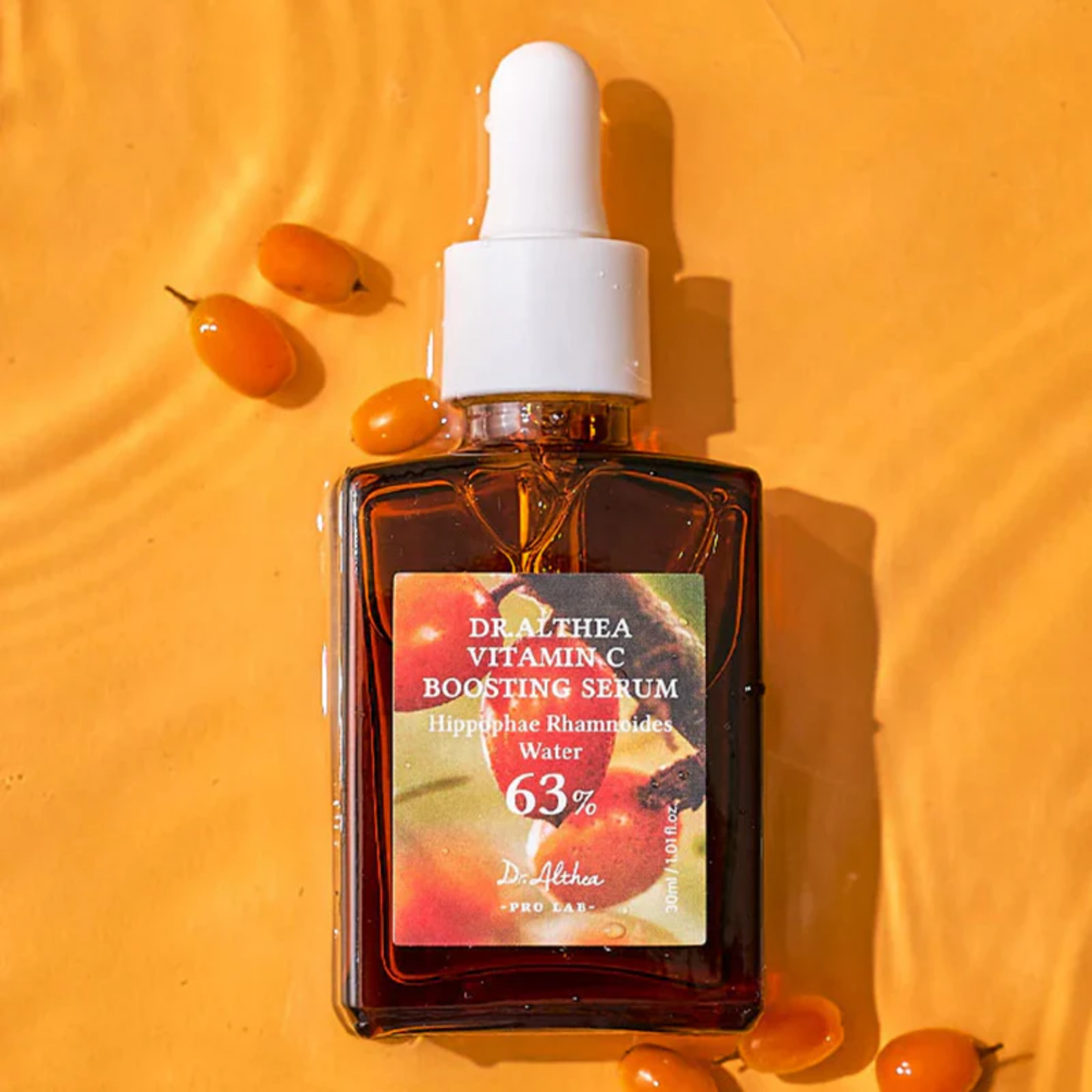 Flatlay of Dr. Althea Vitamin C Boosting Serum with sea buckthorn berries – Korean brightening serum for dull skin