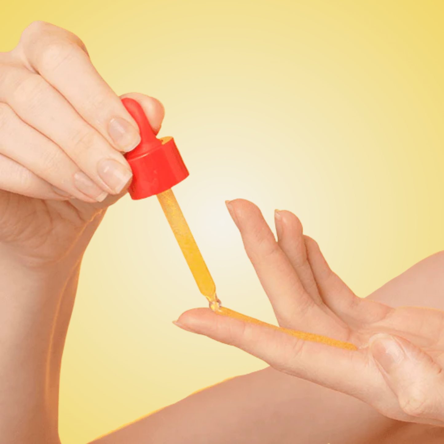 Applying EQQUALBERRY Vitamin Illuminating Serum with dropper on skin.