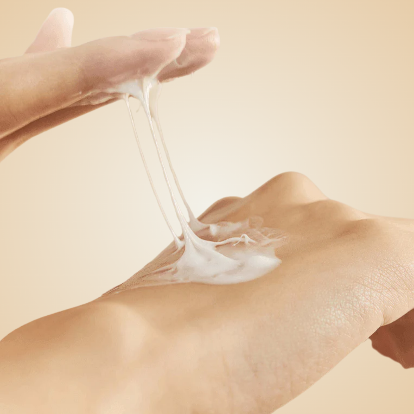 HEVEBLUE Salmon Caring Centella Cream applied on hand – silky texture for calming and nourishing the skin.