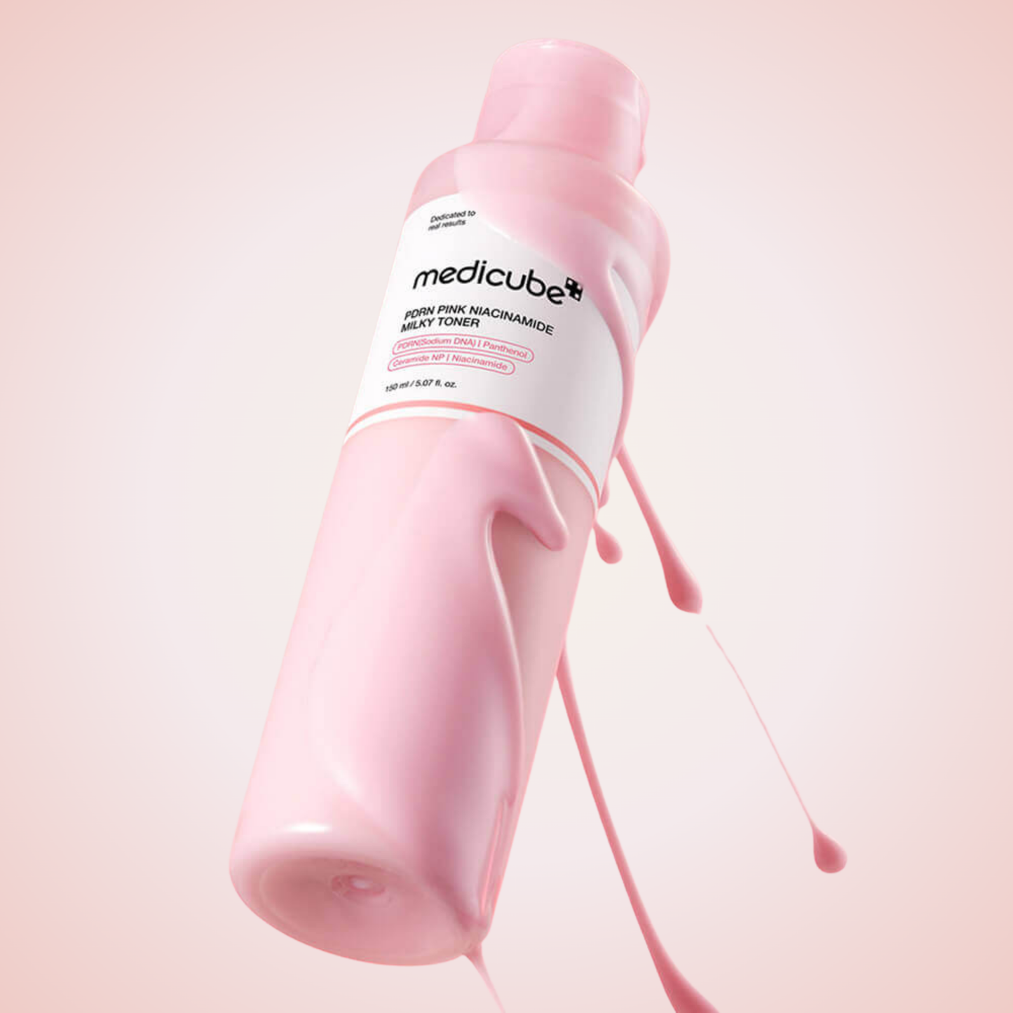 Medicube PDRN Pink Niacinamide Milky Toner tilted bottle with flowing texture – hydrating and radiance-boosting skincare