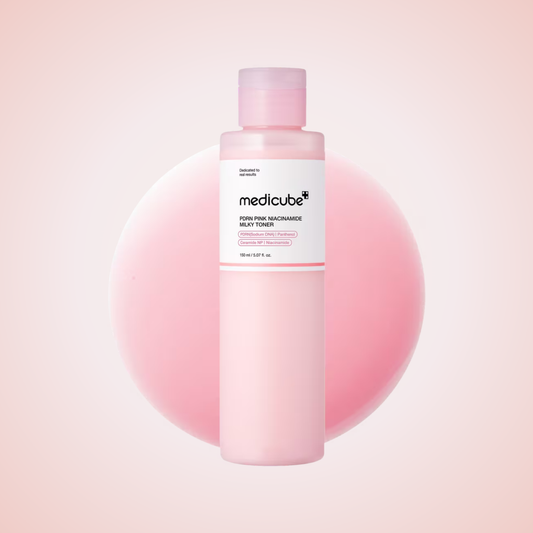 Medicube PDRN Pink Niacinamide Milky Toner bottle on soft pink background – skin-brightening Korean toner