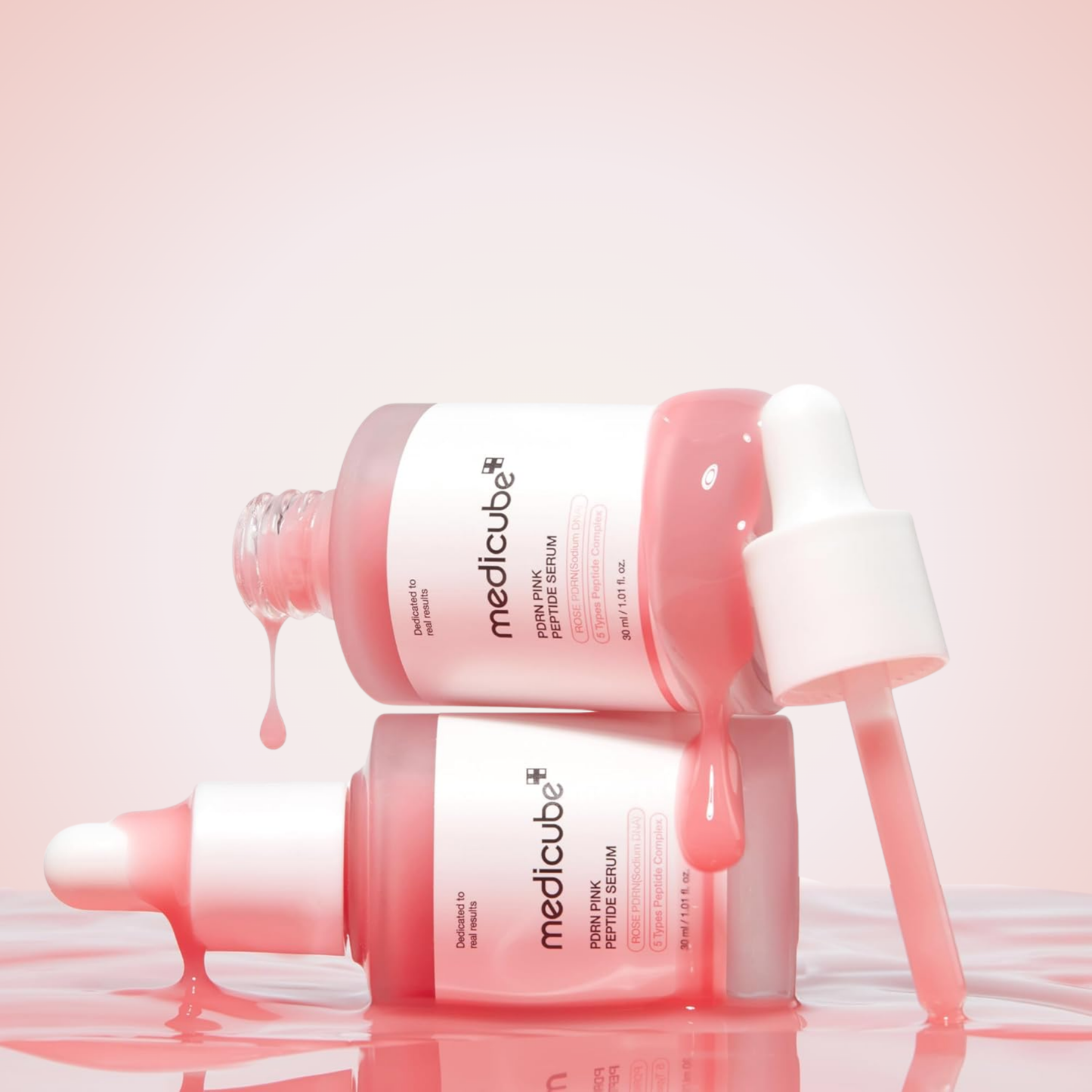 Flatlay of medicube PDRN Pink Peptide Serum bottles – collagen-boosting skincare serum.