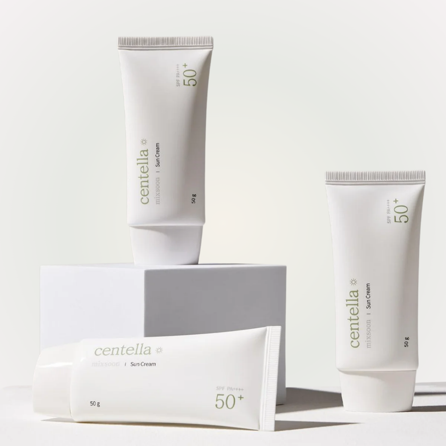 mixsoon Centella Sun Cream SPF 50+ PA++++ tubes stacked on minimalist blocks for clean aesthetic display