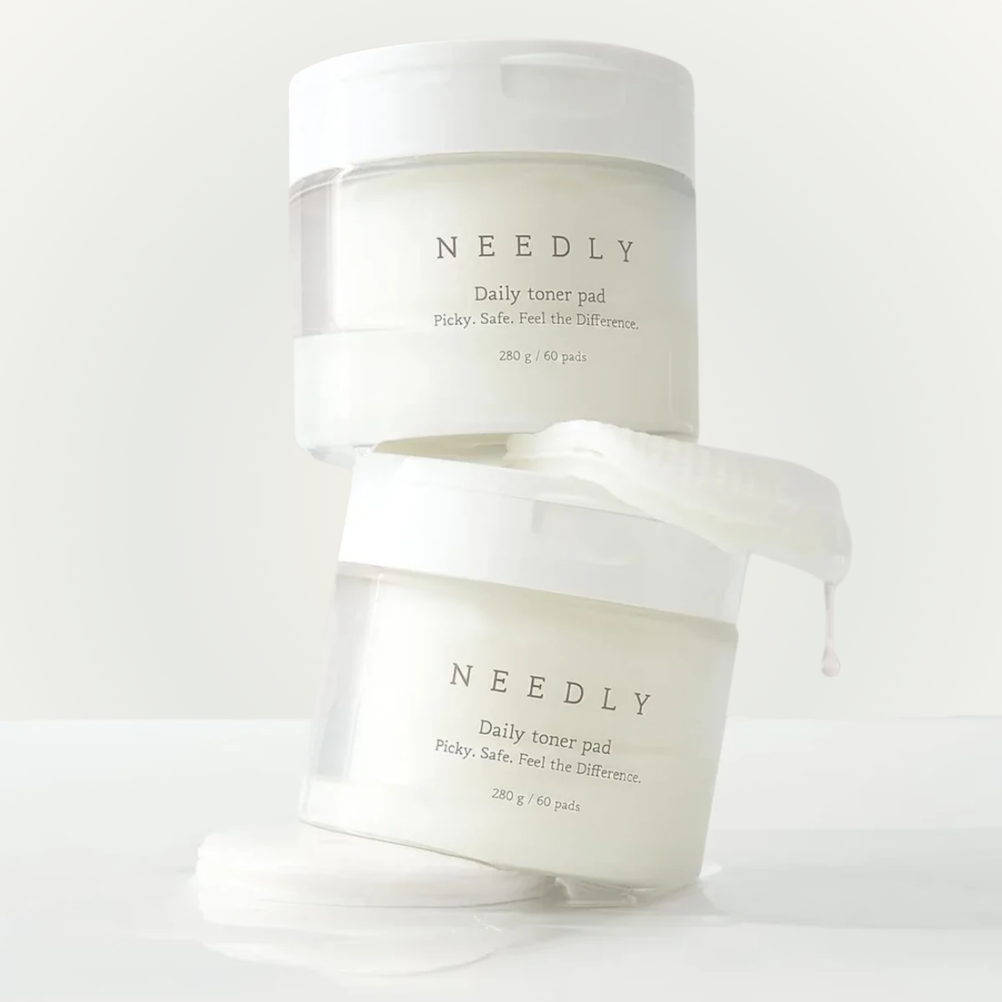 Stacked jars of Needly Daily Toner Pad – minimalist skincare for balanced, smooth complexion