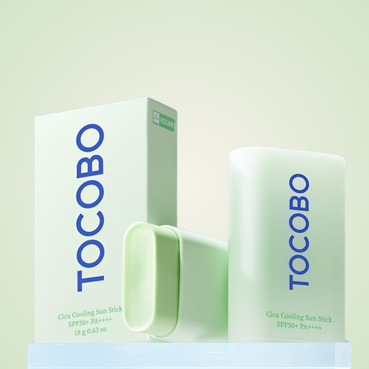 TOCOBO Cica Cooling Sun Stick SPF50+ PA++++ displayed with box packaging on fresh green background