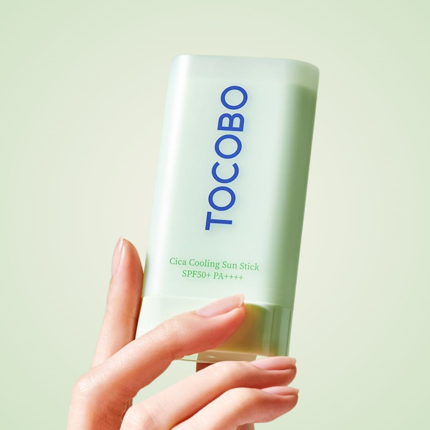 TOCOBO Cica Cooling Sun Stick SPF50+ PA++++ held in hand – minimalist light green packaging