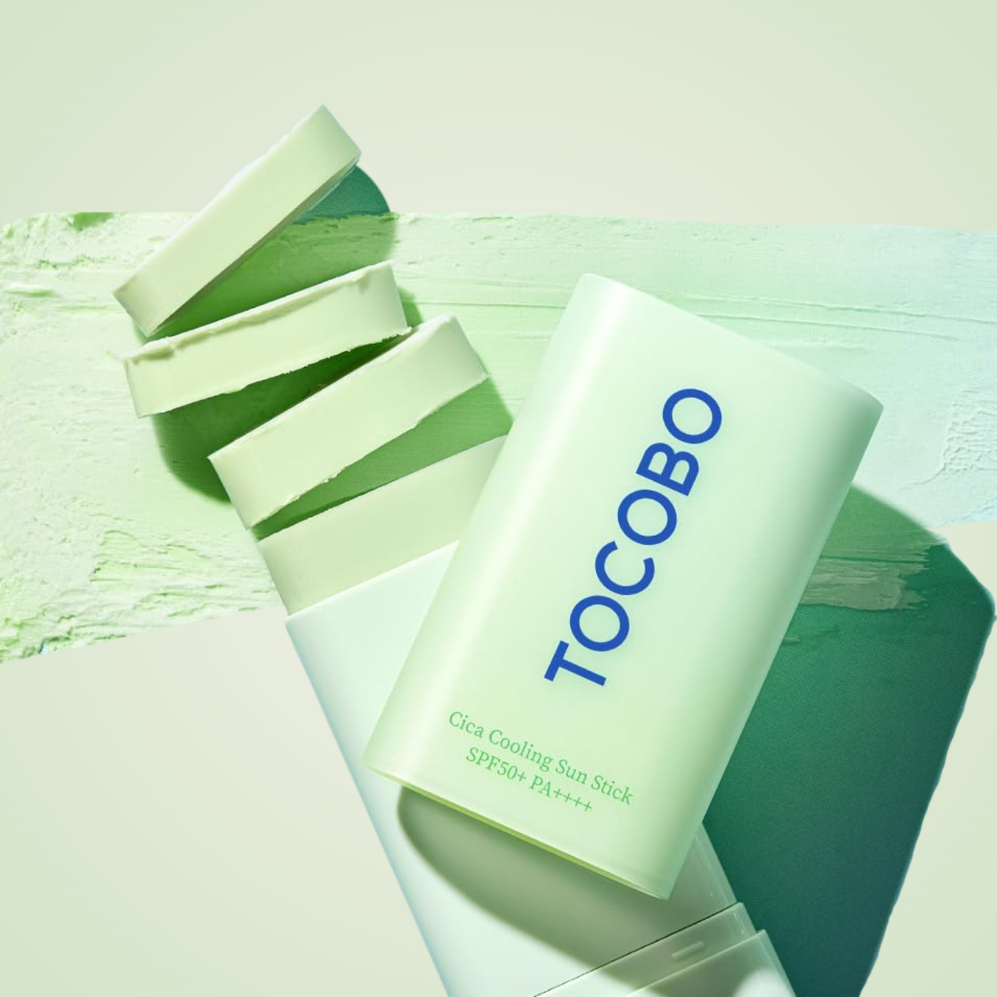TOCOBO Cica Cooling Sun Stick SPF50+ PA++++ flatlay showing mint green texture and sleek design