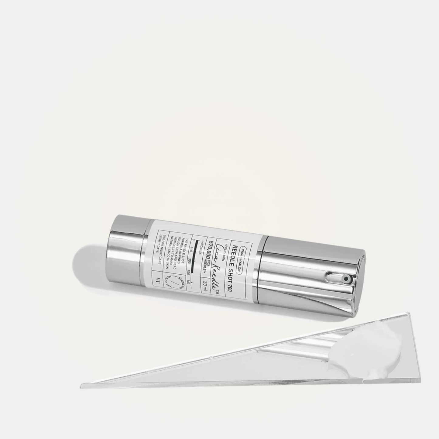 VT Reedle Shot 700 serum flatlay with minimalist mirror and white props – professional skincare display