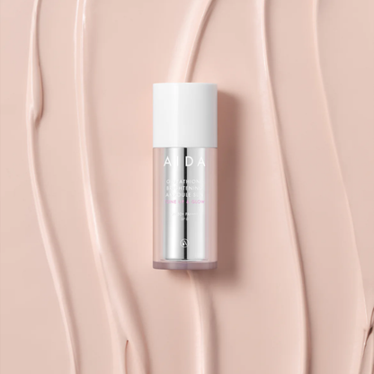 Flatlay of AIDA Glutathione Brightening Ampoule Sun SPF50+ PA++++ on radiant cream background texture
