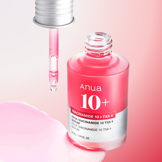 Anua Niacinamide 10% + TXA 4% Serum bottle with serum drop – hydrating brightening serum for smooth, luminous skin.