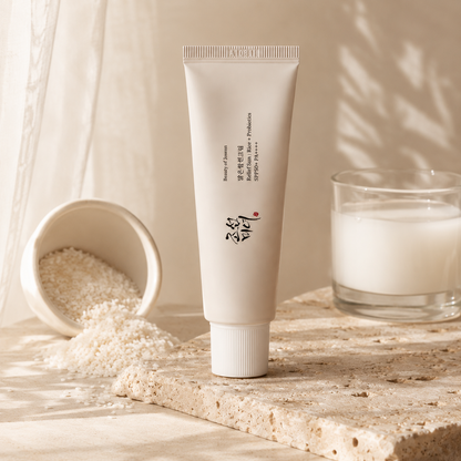 Beauty of Joseon Relief Sun Rice + Probiotics SPF50+ PA++++ 50ml displayed with rice-inspired ingredients on warm travertine, highlighting its rice and probiotic skincare formula in a premium editorial composition.