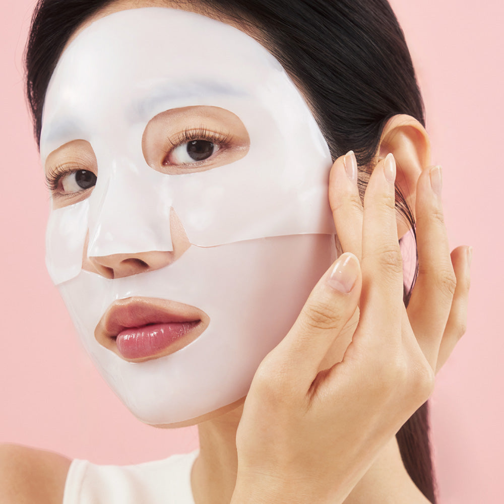 Product imageaBiodance Bio-Collagen Real Deep Mask 34g being applied to the face, showing the glossy hydrogel sheet mask texture in soft natural light.