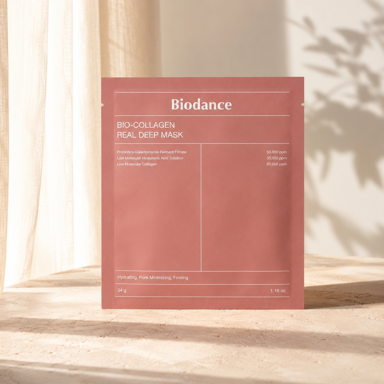 Biodance Bio-Collagen Real Deep Mask 34g styled with its box and pouch on a warm travertine vanity with linen, glass, and soft natural light.