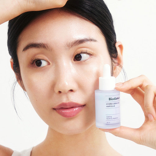 Applying Biodance Hydro Cera-Nol Ampoule to face