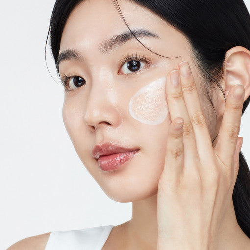 Model applying Biodance Skin Glow Essence Cream for hydrated glass skin finish