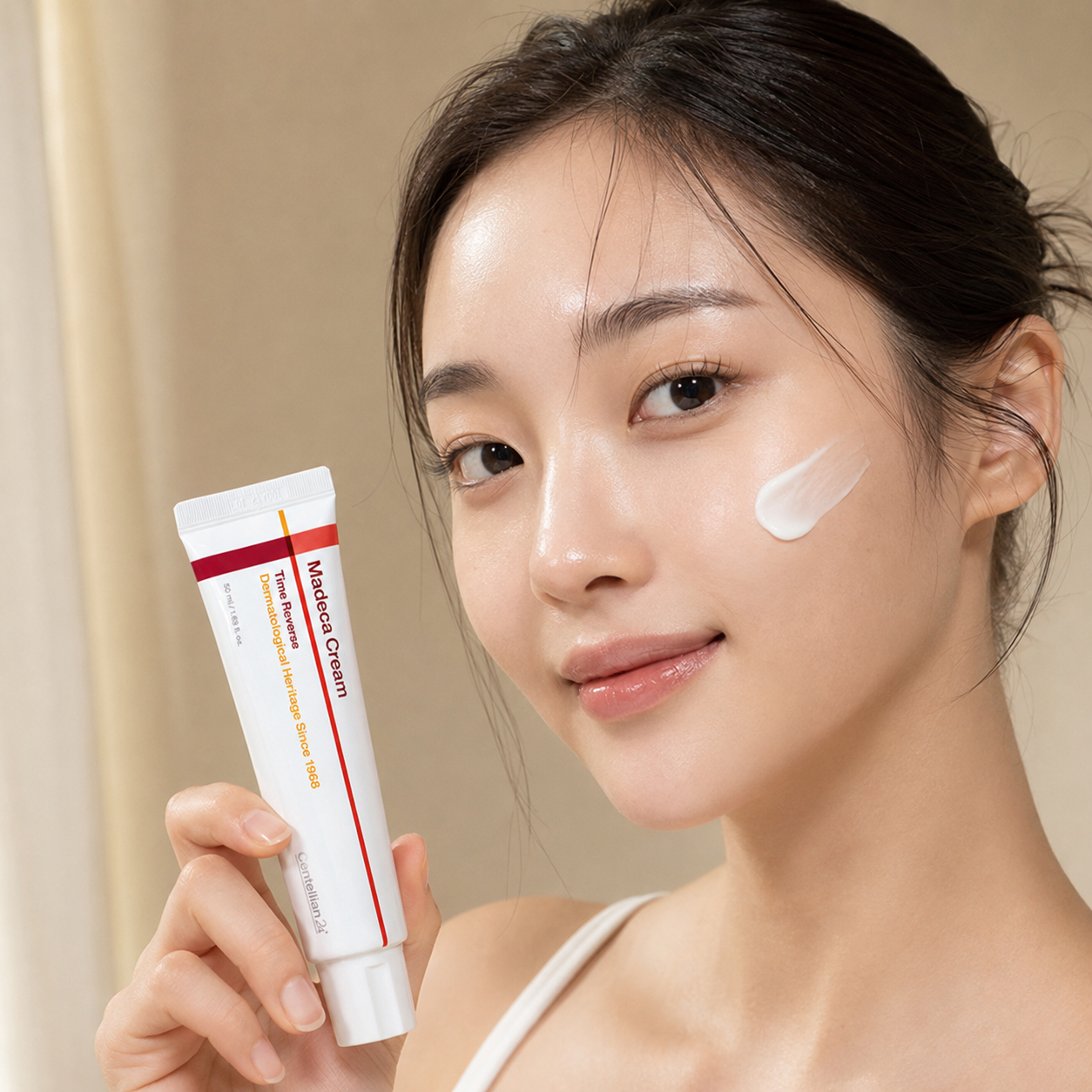 Centellian24 Madeca Cream Time Reverse 50ml shown during face application with a smooth cream swipe on the cheek in soft natural light.