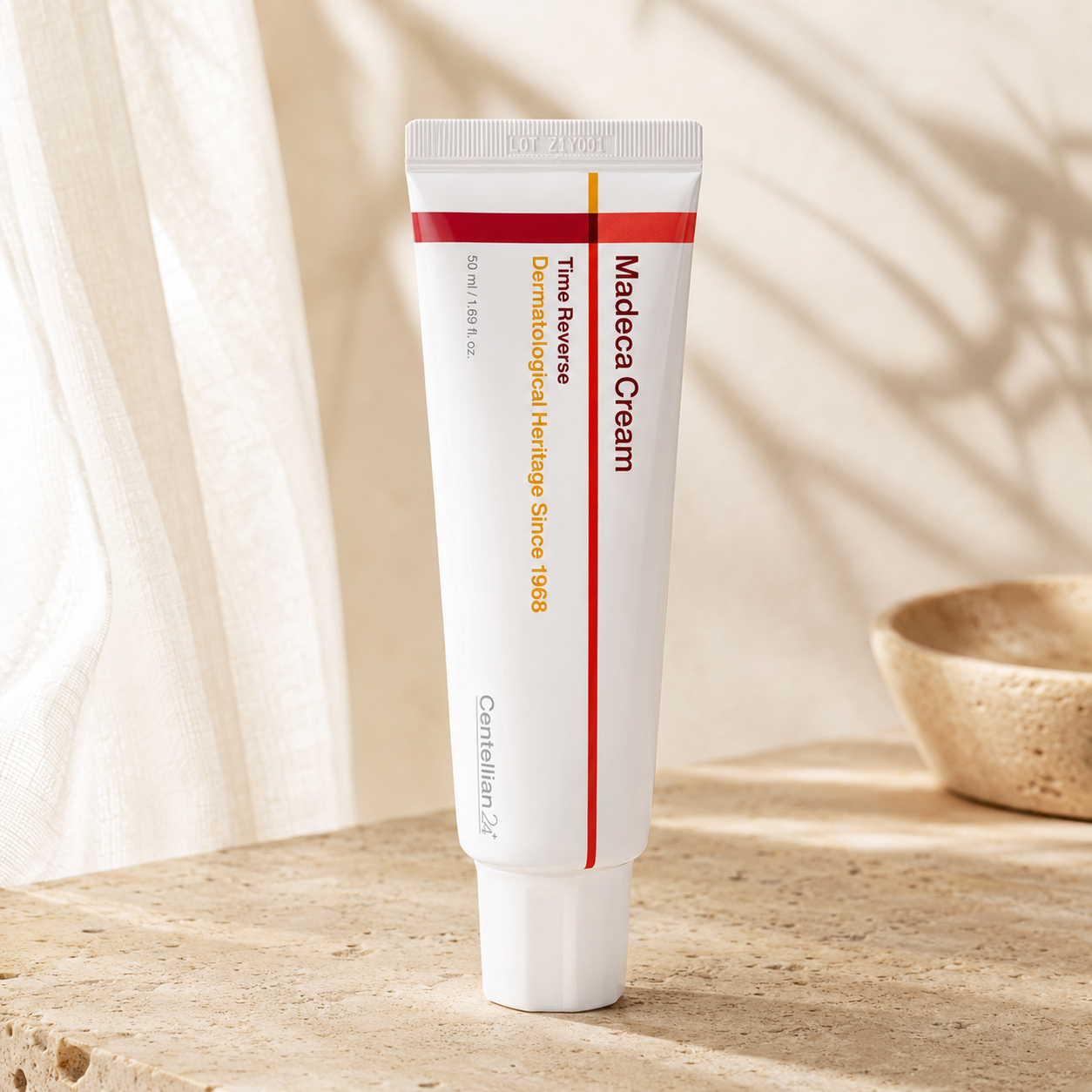 Centellian24 Madeca Cream Time Reverse 50ml displayed upright on warm travertine with soft morning sunlight in a premium Korean skincare hero photo.