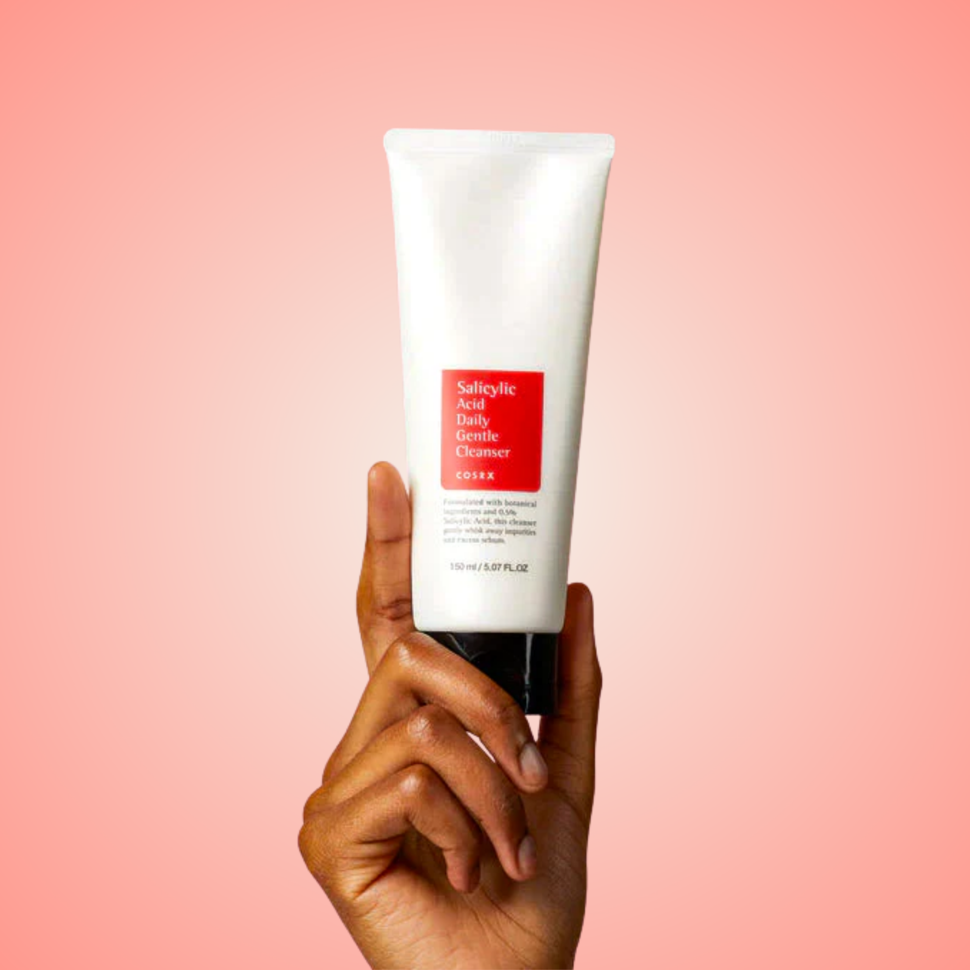 Hand holding COSRX Salicylic Acid Daily Gentle Cleanser tube – daily face wash for clear skin