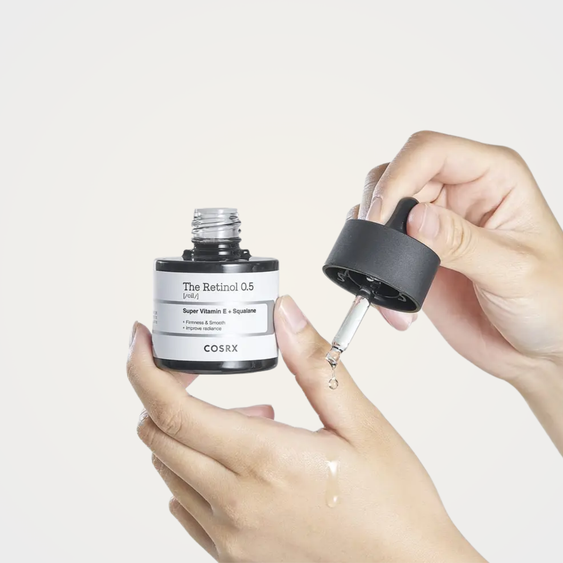 Applying COSRX The Retinol 0.5 Oil on skin – improves firmness, elasticity, and radiance