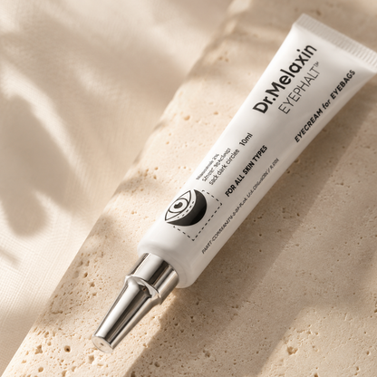 Macro close-up of Dr. Melaxin Eyephalt Eyebag Cream 10ml highlighting the precision applicator tip, premium packaging details, and crisp typography with soft natural lighting.