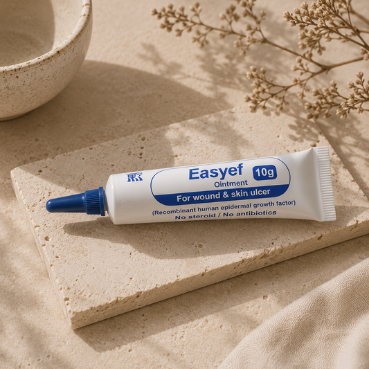 Easyef Ointment 10g displayed on warm beige travertine stone in a luxury editorial skincare setting with soft morning sunlight, delicate botanical shadows, and a minimalist Korean skin recovery aesthetic.