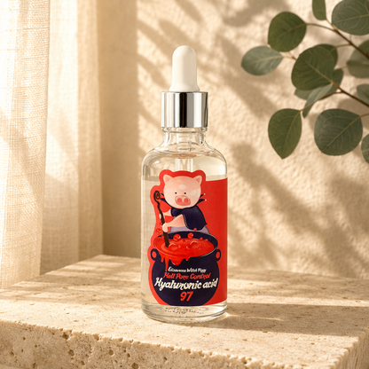 Elizavecca Witch Piggy Hell Pore Control Hyaluronic Acid 97 serum displayed on a warm beige travertine stone under soft morning sunlight with delicate botanical shadows, photographed in a luxury Korean skincare editorial style with the original packaging preserved.