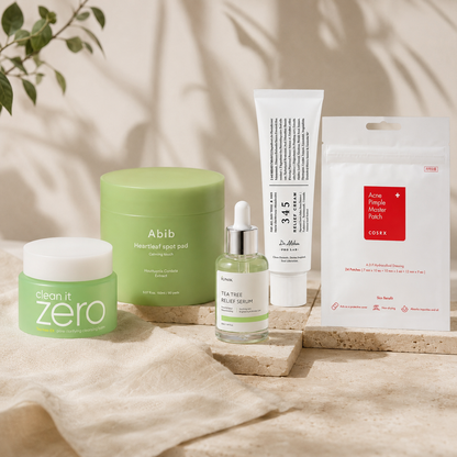 Clear Skin Ritual featuring Banila Co Clean It Zero Cleansing Balm, Abib Heartleaf Spot Pad, iUNIK Tea Tree Relief Serum, Dr. Althea 345 Relief Cream, and COSRX Pimple Master Patch in a warm editorial skincare setting.