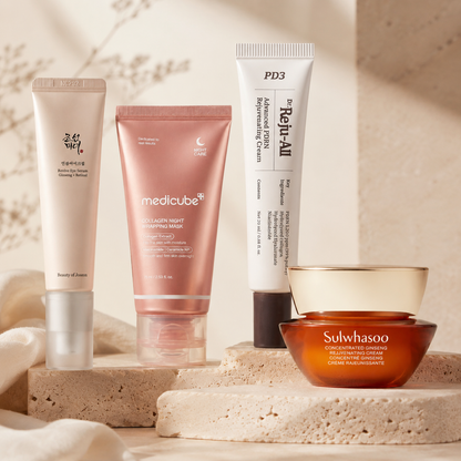 Beauty of Joseon Revive Eye Serum, Medicube Collagen Night Wrapping Mask, Dr. Reju-All Advanced PDRN Rejuvenating Cream, and Sulwhasoo Concentrated Ginseng Rejuvenating Cream styled in a warm luxury skincare setting.
