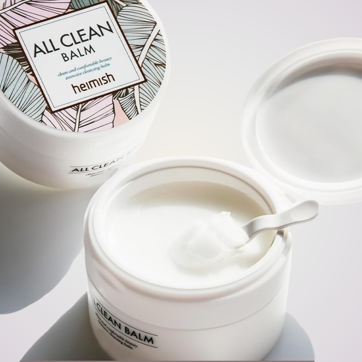 Open jar of Heimish All Clean Balm – gentle solid balm that transforms into oil for deep cleansing