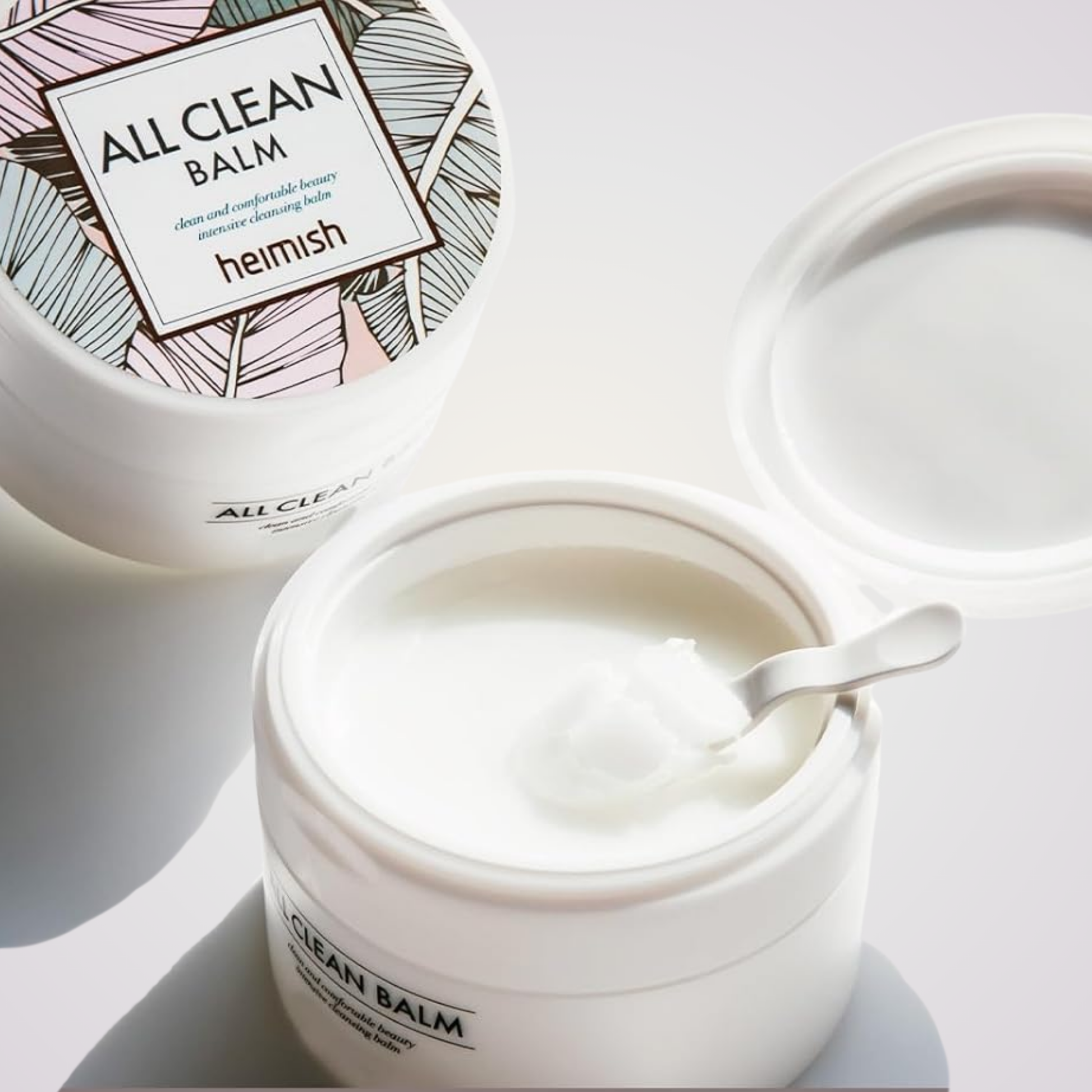 Open jar of Heimish All Clean Balm – gentle solid balm that transforms into oil for deep cleansing