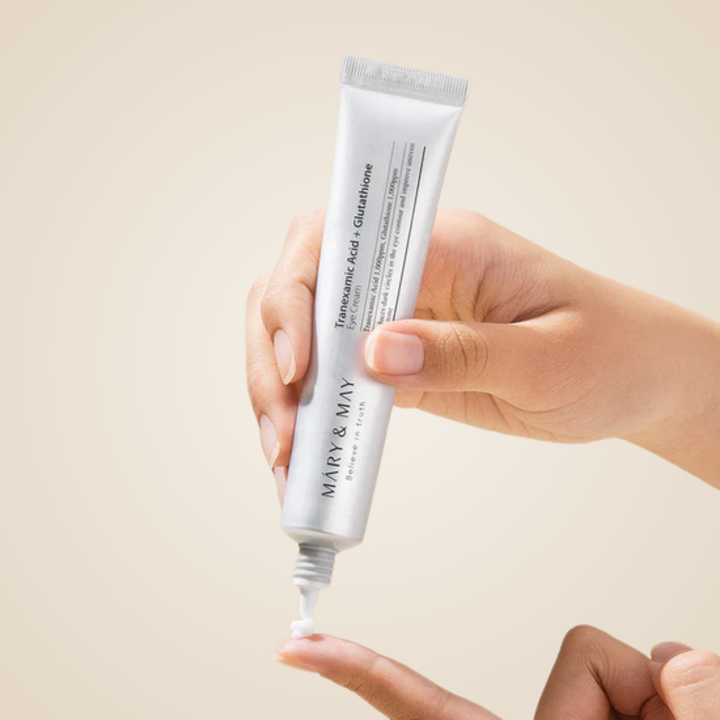 Applying Mary & May Tranexamic Acid + Glutathione Eye Cream on fingertip for bright, nourished under eyes