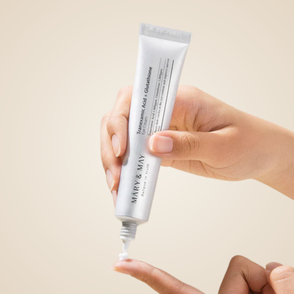 Applying Mary & May Tranexamic Acid + Glutathione Eye Cream on fingertip for bright, nourished under eyes