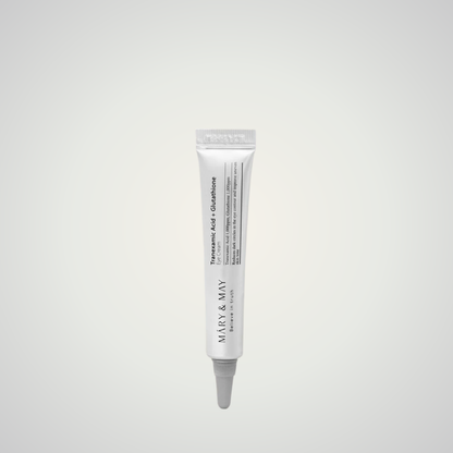 Mary & May Tranexamic Acid + Glutathione Eye Cream tube on beige background – brightening under-eye treatment