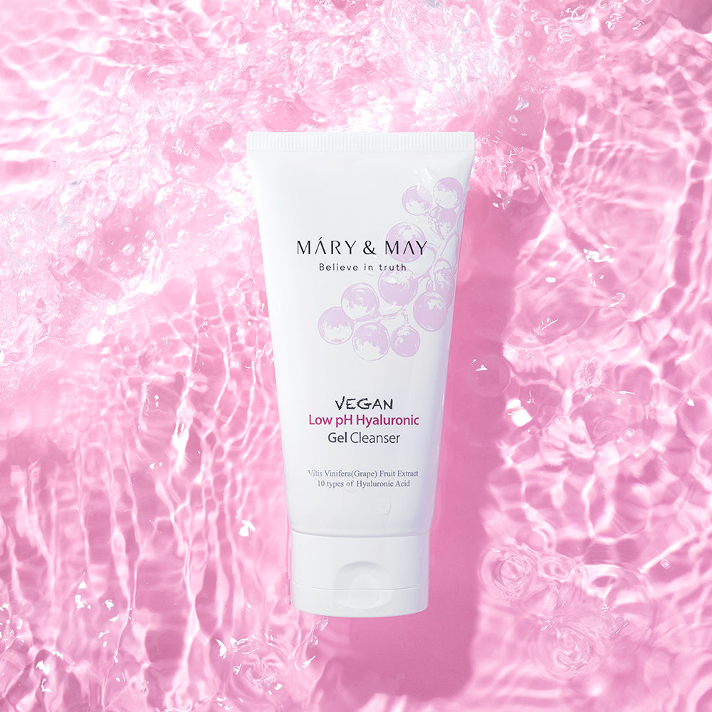 MARY & MAY Vegan Low pH Hyaluronic Gel Cleanser 150ml — cleanser tube against pink water.