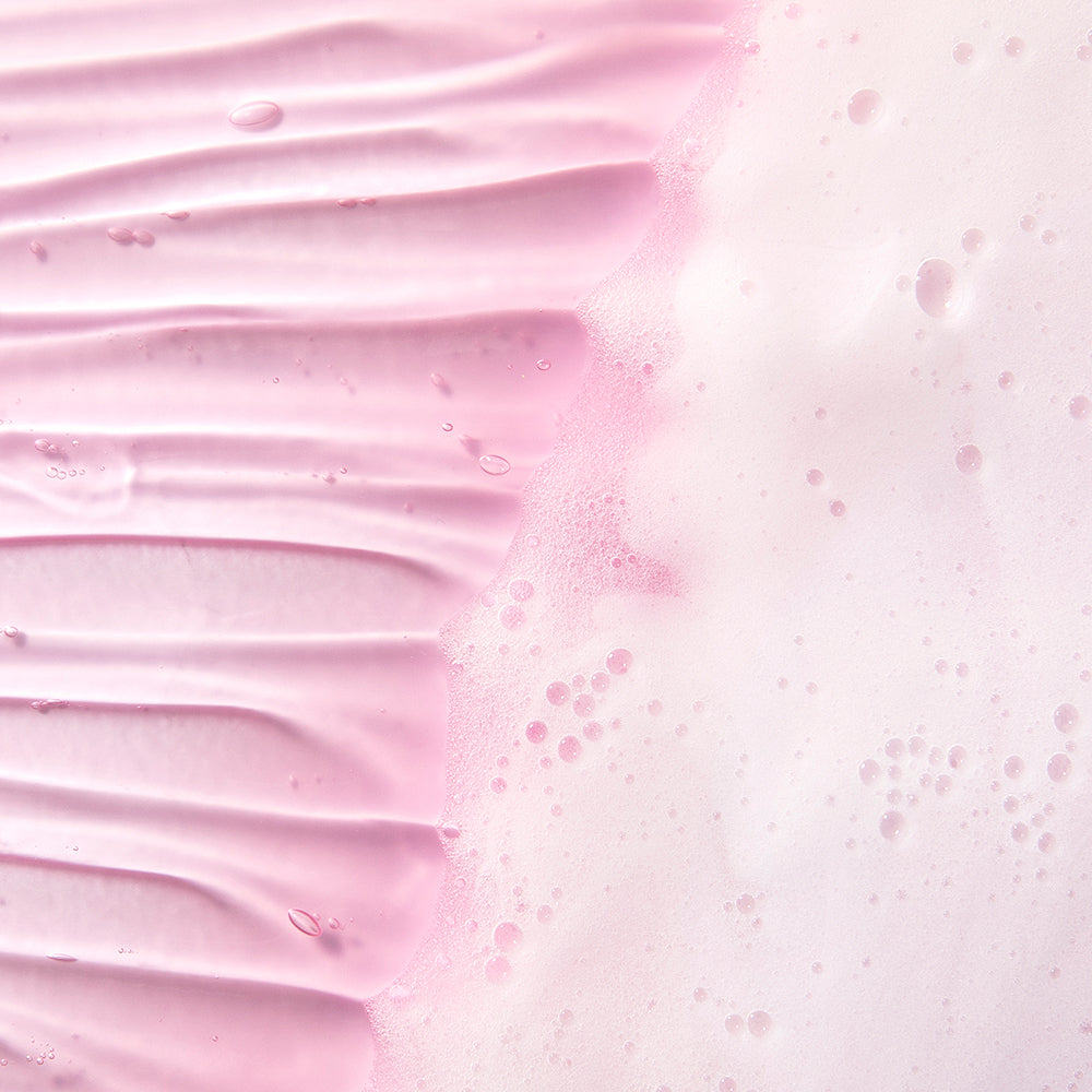 MARY & MAY Vegan Low pH Hyaluronic Gel Cleanser 150ml — close-up of pink cleanser lather.