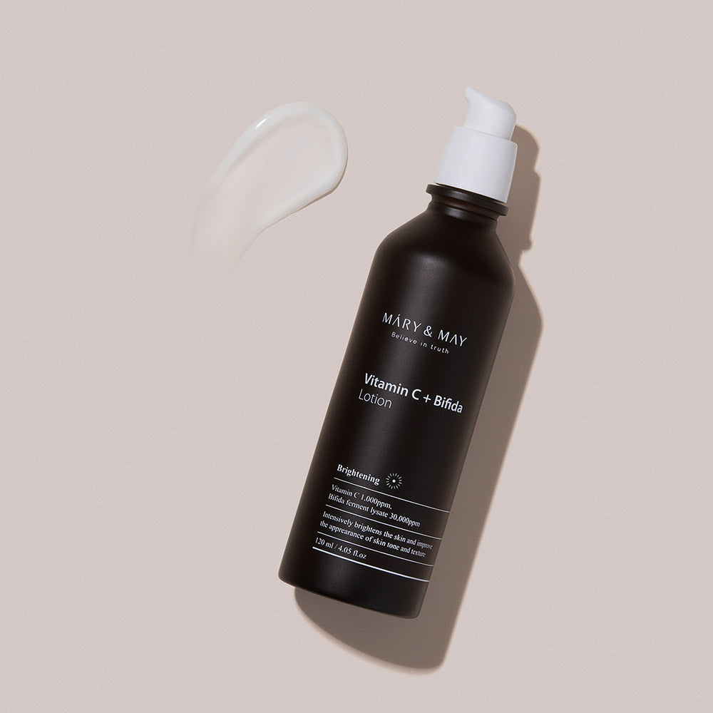 MARY & MAY Vitamin C+Bifida Lotion 120ml — lotion bottle beside a white texture swatch.