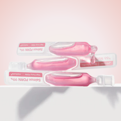 Flatlay of Medicube PDRN Pink One Day Serum 10EA with opened vials – daily Korean skincare treatment for elasticity