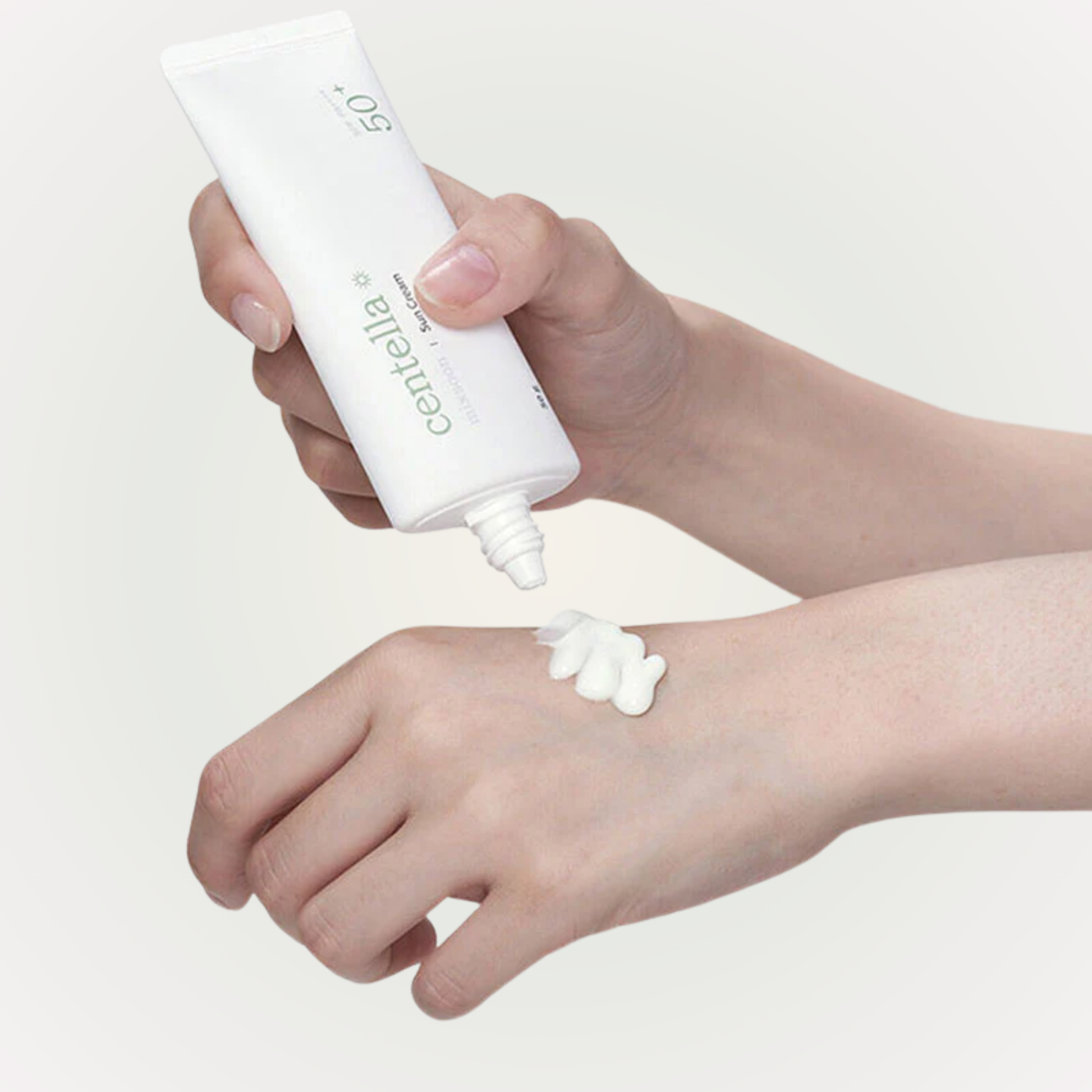 Applying mixsoon Centella Sun Cream SPF 50+ PA++++ on hand for gentle UV protection and hydration