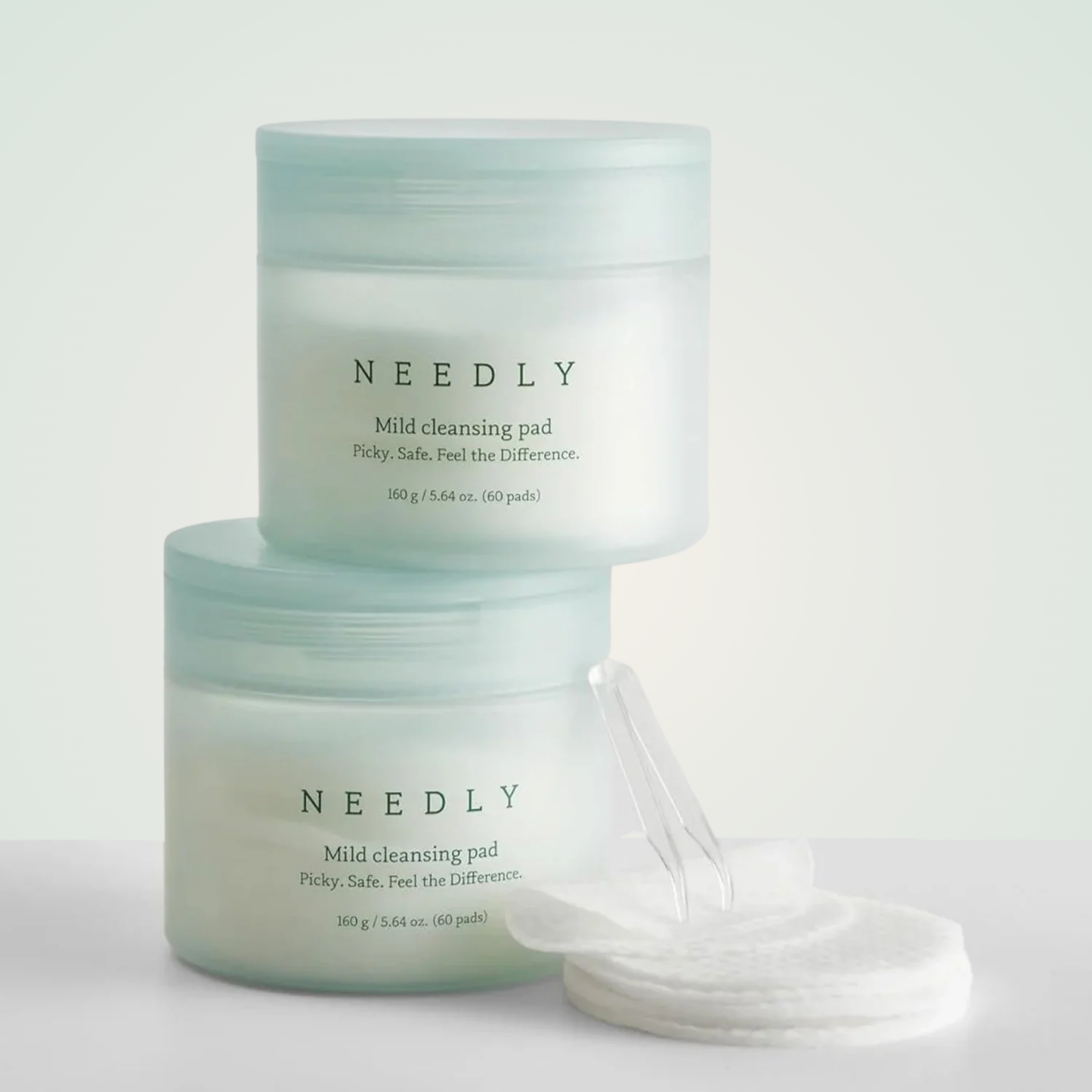Stack of NEEDLY Mild Cleansing Pads – calming, low-pH pads to remove impurities and balance the skin barrier