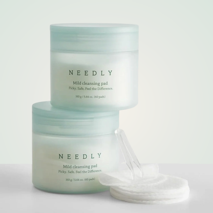 Stack of NEEDLY Mild Cleansing Pads – calming, low-pH pads to remove impurities and balance the skin barrier