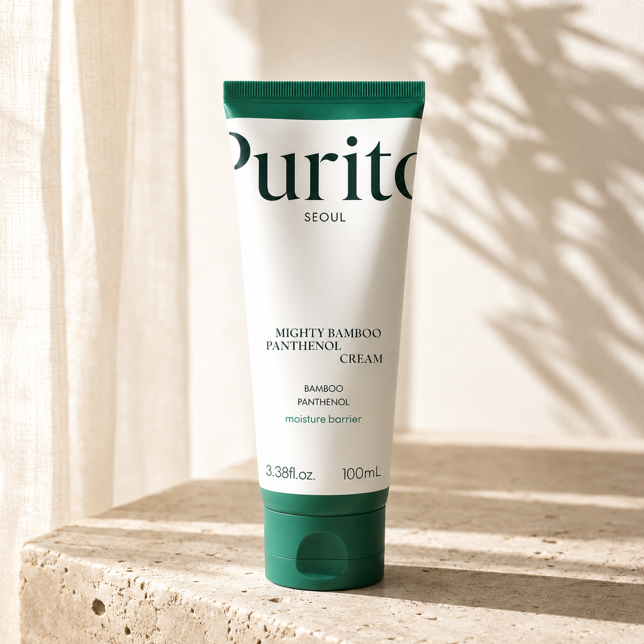 Purito Seoul Mighty Bamboo Panthenol Cream 100ml on warm travertine in soft morning light, luxury Korean skincare editorial hero photography highlighting moisture barrier care.