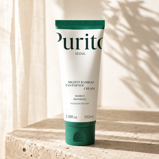 Purito Seoul Mighty Bamboo Panthenol Cream 100ml on warm travertine in soft morning light, luxury Korean skincare editorial hero photography highlighting moisture barrier care.