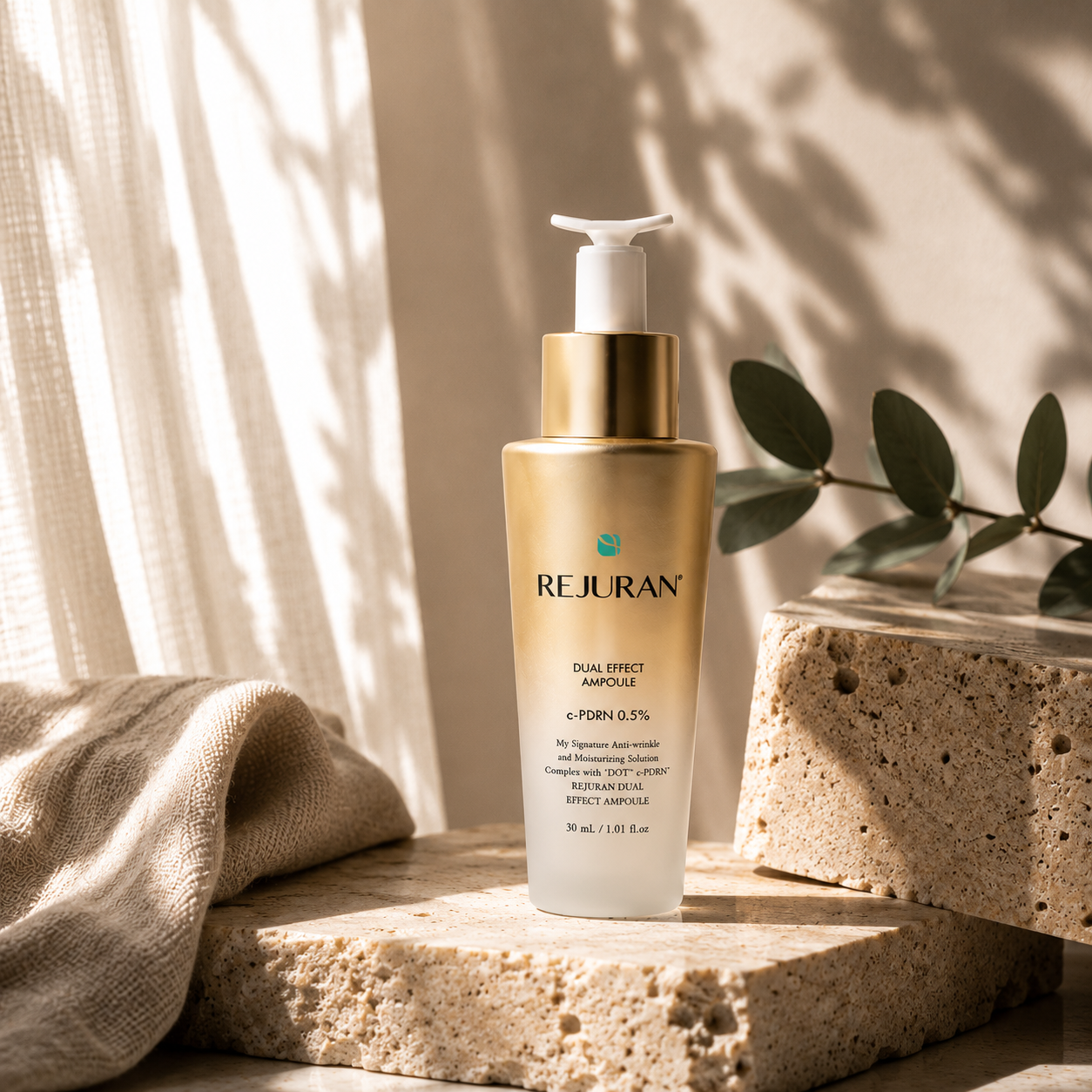 REJURAN Healer Turnover Ampoule Dual Effect PDRN 30ml naturally placed on a travertine tray with folded beige linen, ceramic cup, and eucalyptus in a calming Korean skincare ritual scene.
